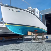 Boat hull with fresh bottom paint after professional dive cleaning service